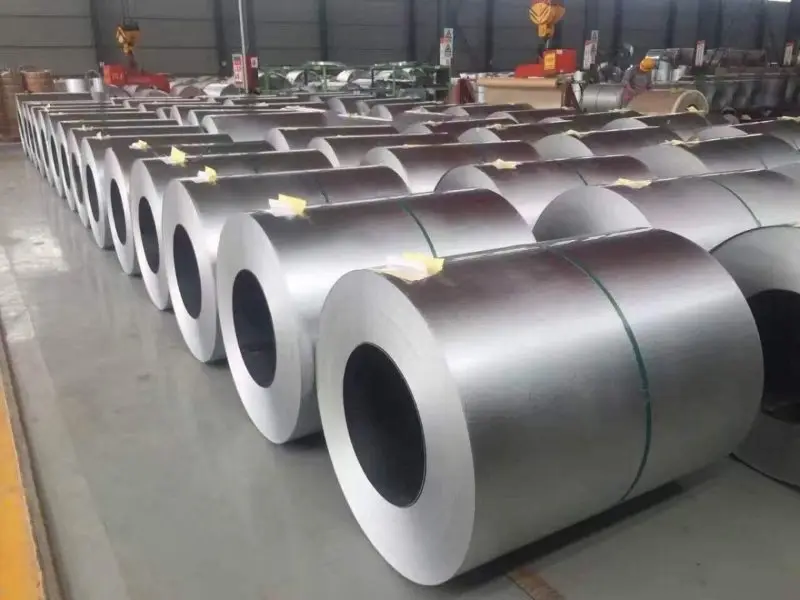Steel coils stored inside a metal production facility
